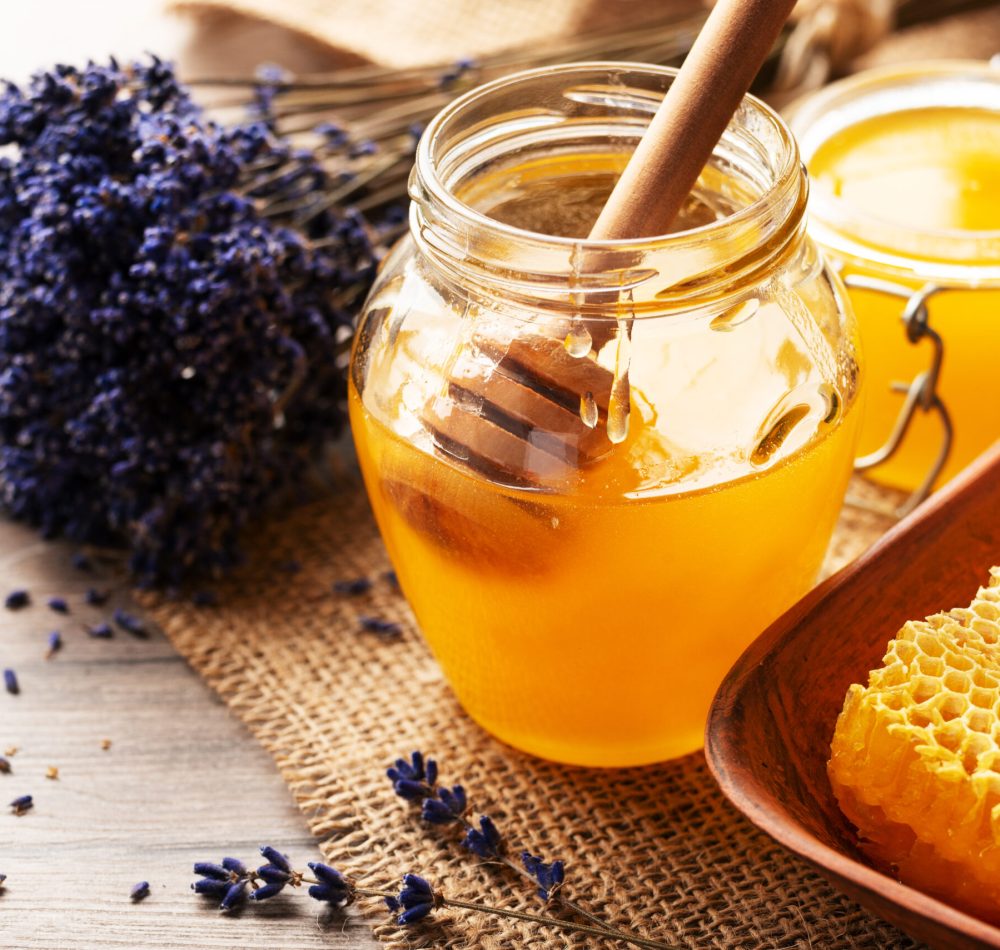 Honeycomb in clay dish on kitchen table sweet background